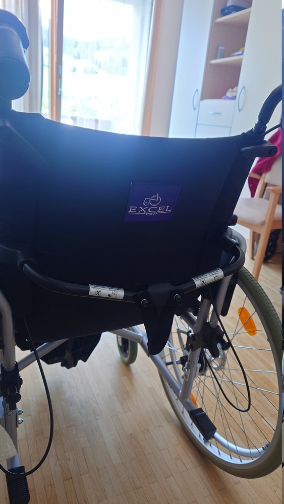 Photograph of a wheelchair branded 'Excel'