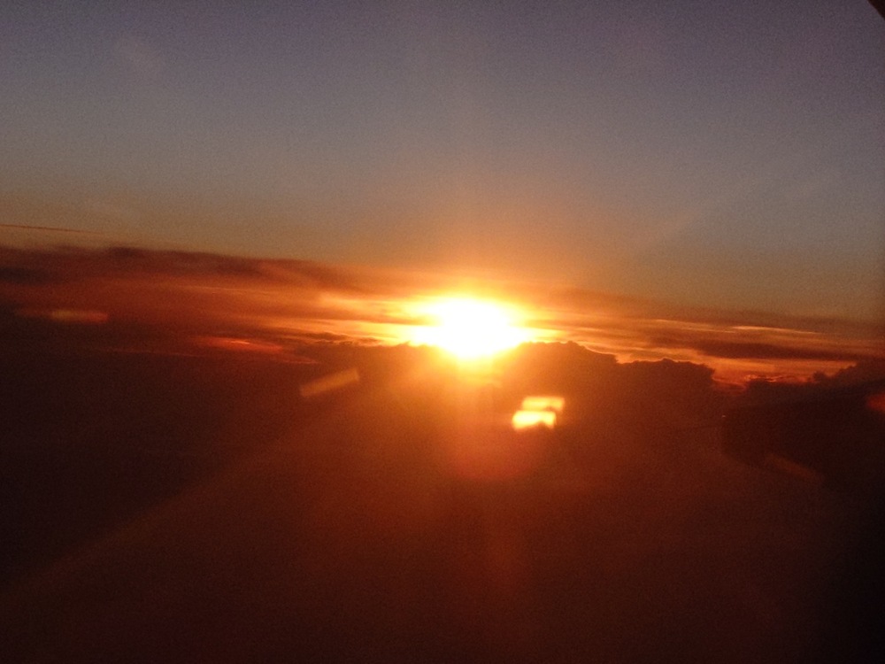 Photograph of a sunset taken from an airplane