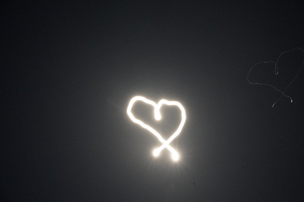 Heart drawing by long exposure on the moon
